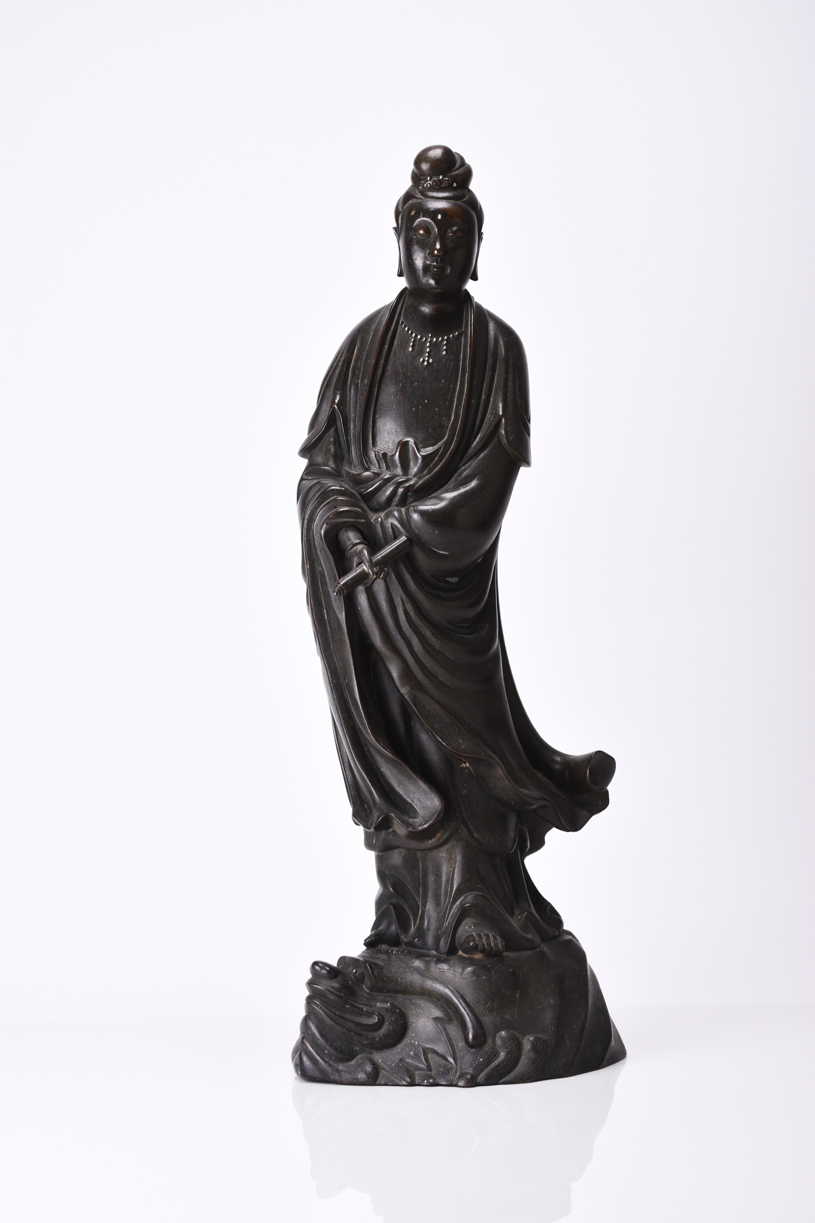 A Chinese silver-inlaid, bronze figure of Guanyin valued at up to £5,000.  Halls Fine Art