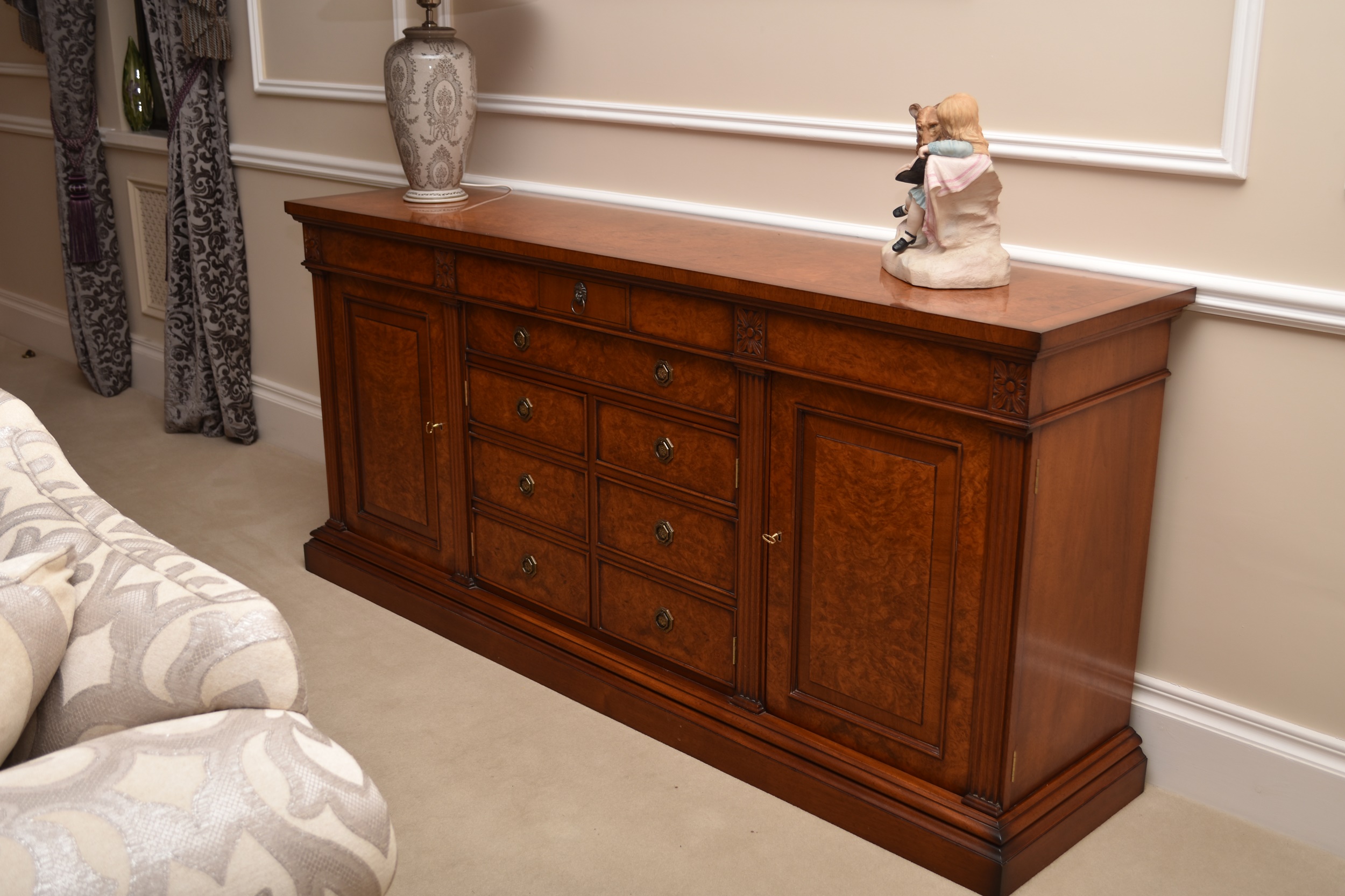 A Charles Barr burr walnut and mahogany veneered credenza-form sideboard