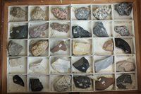 Lot 135 - A cased collection of minerals, rocks and...