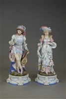 Lot 168 - A pair of French porcelain figures of male and...