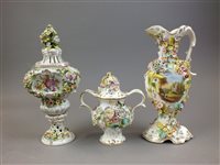 Lot 220 - A Continental twin handled floral encrusted...