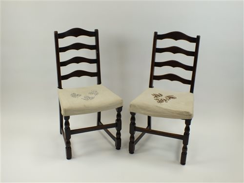 Lot 39 - A set of four oak ladder back dining chairs...