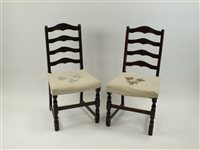 Lot 39 - A set of four oak ladder back dining chairs...