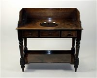 Lot 40 - A Victorian mahogany washstand, the low panel...