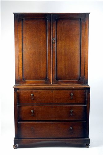 Lot 92 - An oak kitchen cabinet, 1920s, with two...