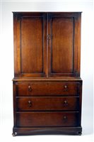 Lot 92 - An oak kitchen cabinet, 1920s, with two...