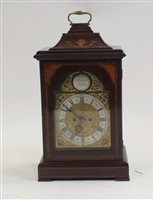 Lot 103 - An Edwardian mahogany and inlaid bracket clock...