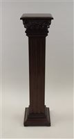 Lot 52 - A reproduction mahogany torchere stand, the...