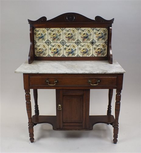 Lot 54 - A late Victorian walnut marble topped wash...