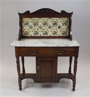 Lot 54 - A late Victorian walnut marble topped wash...