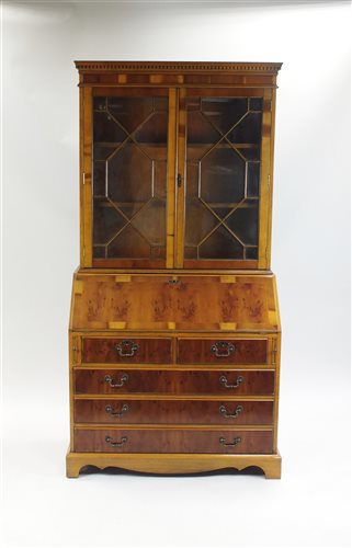 Lot 360 - A reproduction walnut bureau bookcase, with...