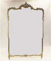 Lot 70 - A large Rococo style gilt framed wall mirror,...