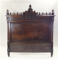 Lot 82 - A French walnut Gothic revival double bed with...