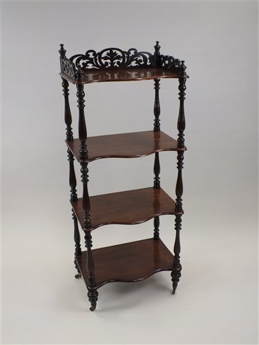 Lot 84 - A Victorian walnut four tier what not 19th...