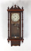 Lot 107 - A walnut style Vienna style wall clock, late...