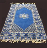 Lot 311 - A blue Moroccan wool rug