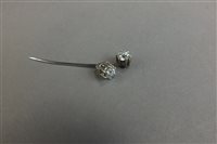 Lot 22 - Two old cut diamonds, within white metal claw...