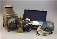 Lot 244 - A miner's helmet, lamp, and mask together with...