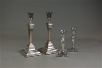 Lot 154 - A pair of Victorian short silver candlesticks,...