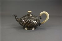 Lot 158 - A French silver teapot, of wrythen circular...