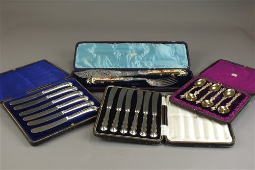 Lot 4 - Two cased sets of six silver handle knives,...