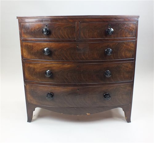 Lot 22 - A Regency mahogany bowfront chest of two short...