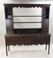 Lot 27 - A Victorian scumbled pine dresser and rack,...