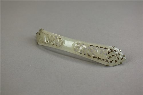 Lot 30 - A carved nephrite hair slide, with bird and...