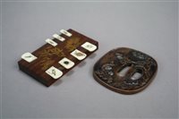 Lot 160 - A Japanese Bronze Tsuba and a Game Marker