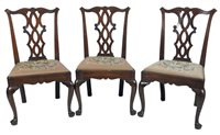 Lot 235 - A set of six George II mahogany dining chairs,...