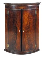 Lot 286 - A George III mahogany and inlaid bow front...