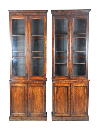 Lot 229 - A pair of Regency rosewood narrow bookcases,...