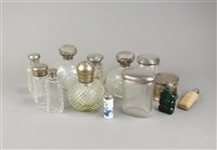Lot 8 - A collection of eight silver topped dressing table jars