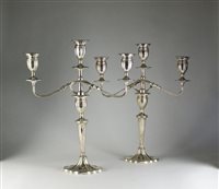 Lot 98 - A pair of silver candelabra