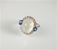 Lot 206 - An 18ct gold moonstone, sapphire and diamond ring