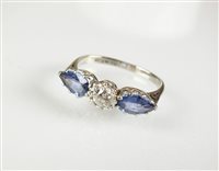 Lot 221 - A three stone sapphire and diamond ring