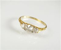 Lot 241 - A three stone diamond ring