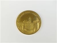 Lot 325 - A silver gilt medallion