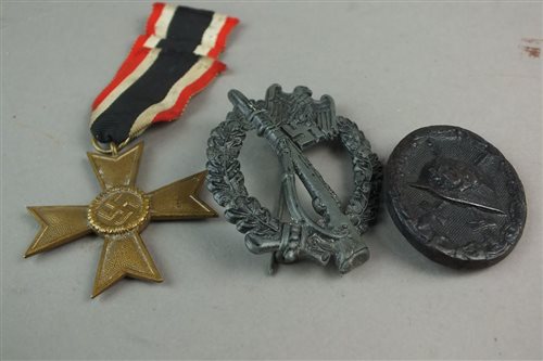 Lot 339 - A pair of Nazi vests, War Merit badge, Wound badge and a leather whip