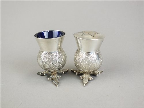 Lot 9 - A Scottish silver thistle salt and pepperette