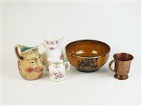 Lot 78 - A Sarreguemines Whisky mask jug, further ceramics and a copper measure