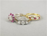 Lot 34 - A five stone ruby and diamond ring