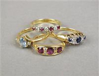 Lot 15 - An 18ct gold seven stone red stone and diamond ring