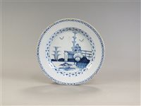 Lot 142 - An 18th century blue and white delft charger