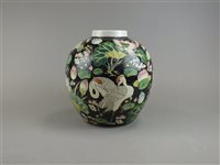 Lot 92 - A Chinese famille noir jar
