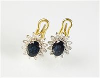 Lot 262 - A pair of sapphire and diamond earrings
