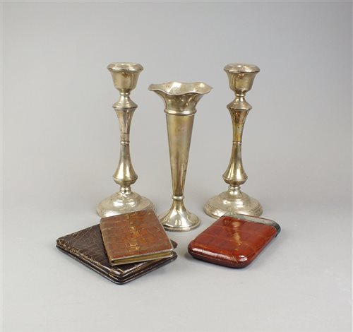 Lot 16 - A pair of silver mounted candlesticks