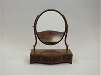 Lot 350 - A George III cross banded mahogany serpentine front toilet mirror