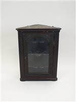 Lot 189 - A Victorian carved and glazed oak corner cupboard