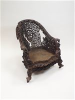 Lot 89 - An Anglo-Indian carved hardwood tub armchair for restoration